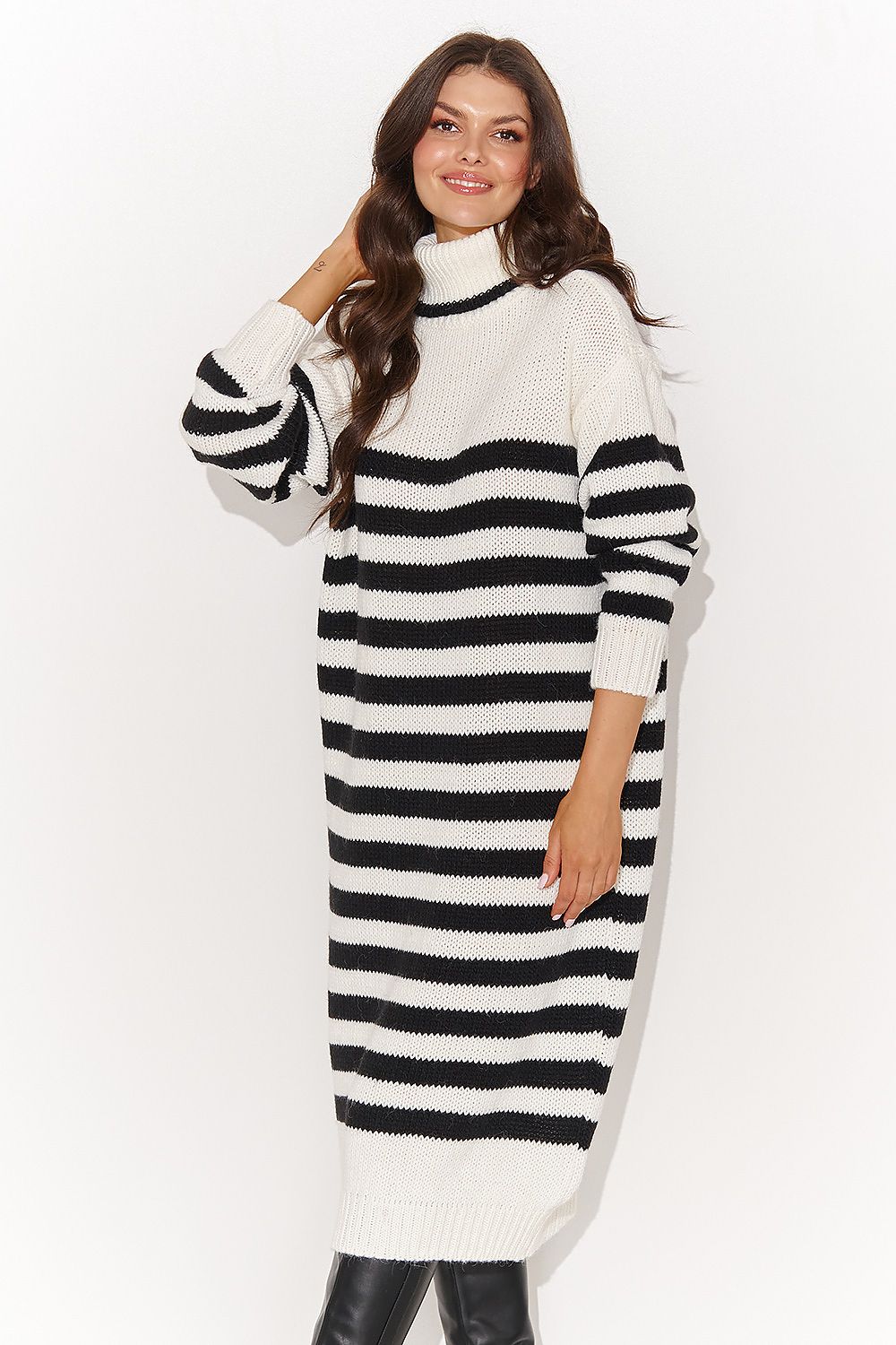 Elegant women's turtleneck sweater dress by Numinou featuring decorative stripes in a voluminous design, perfect for a stylish winter look.
