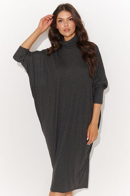 Luxurious oversize turtleneck daydress from Numinou in graphite melange and black, showcasing the elegant design and delicate creases, perfect for chic fashion ensembles.