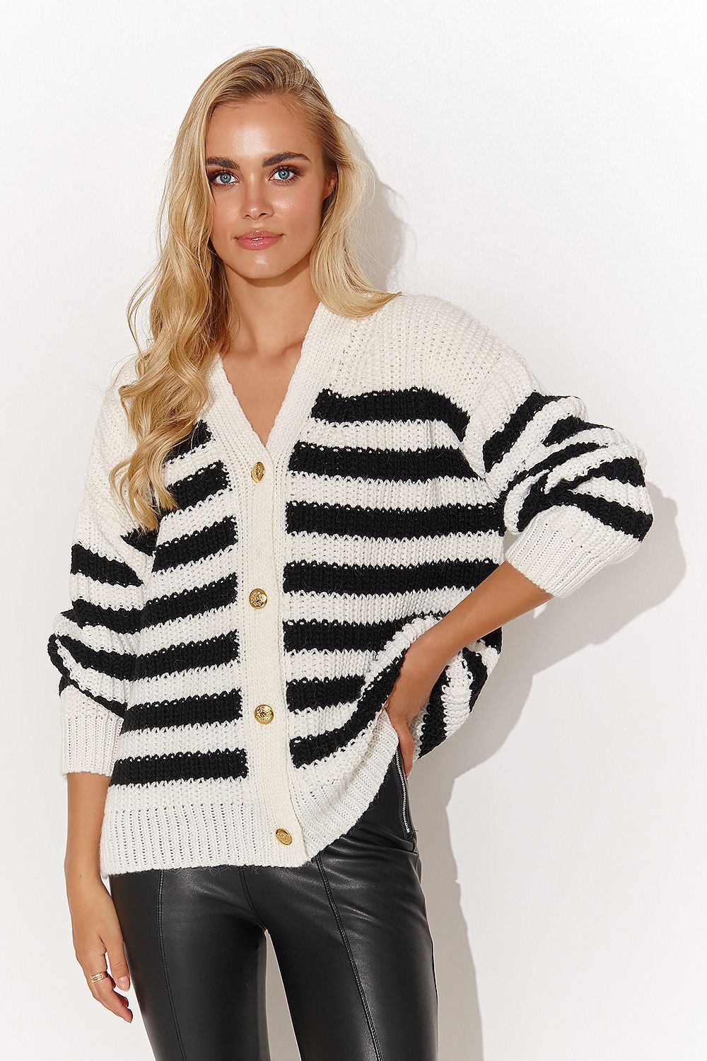 Elegant women's cardigan sweater by Makadamia adorned with gold buttons and a heart neckline, showcasing thick stripes in ecru and cappuccino colours, perfect for a luxurious winter outfit.