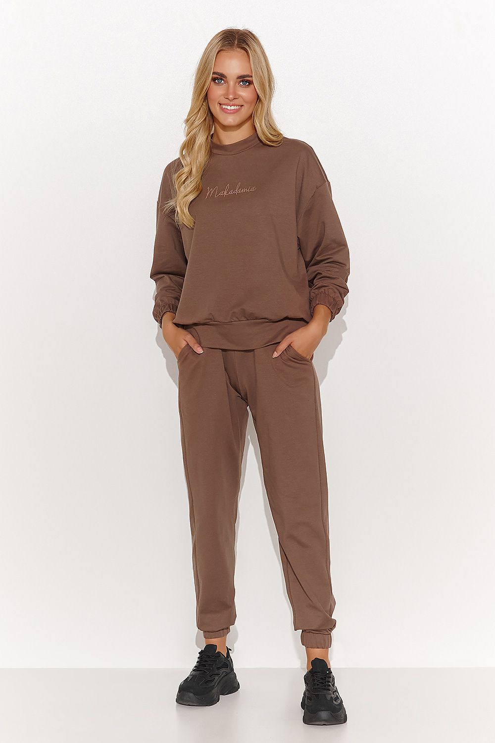 Elegant Women's Macadamia Sweatshirt and Pant Set in Sand, showcasing luxury casual wear. Perfect for comfort and style by Makadamia.