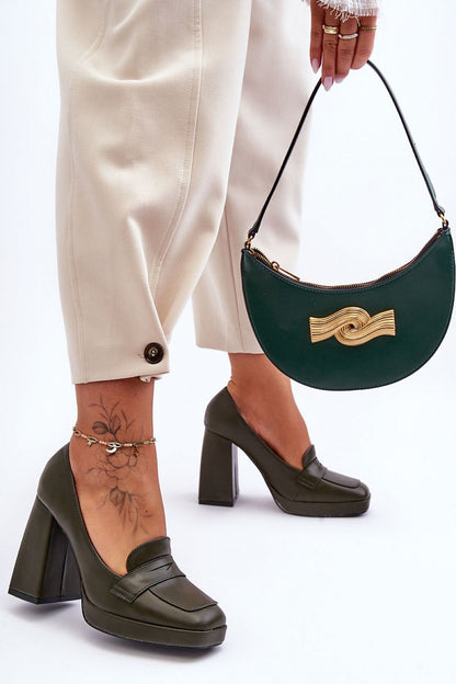 Chic green eco-leather heels from Step in Style, complemented by a stylish handbag, perfect for a sophisticated look.
