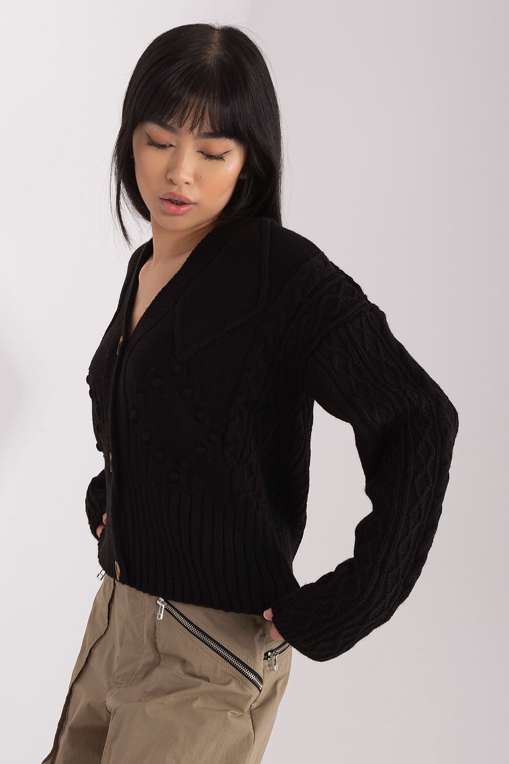 Elegant Badu acrylic cardigan featuring a heart neckline and button closure, perfect for stylish casual outfits.