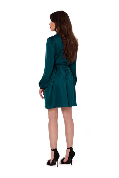 Model wearing the Makover satin evening dress with long sleeves and mini length, ideal for stylish evening events.