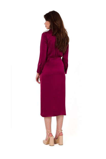 Elegant satin cocktail dress by Makover featuring an asymmetrical skirt, long sleeves, and sophisticated overlap neckline - perfect for luxury occasions.