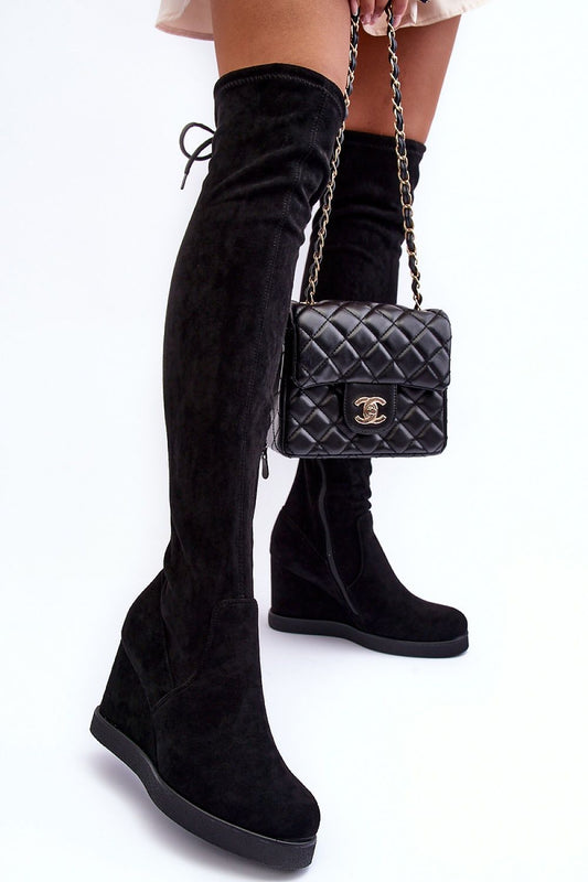 Chic black buskin boots with a tied upper and side zipper, featuring a stylish wedge heel by Step in Style.