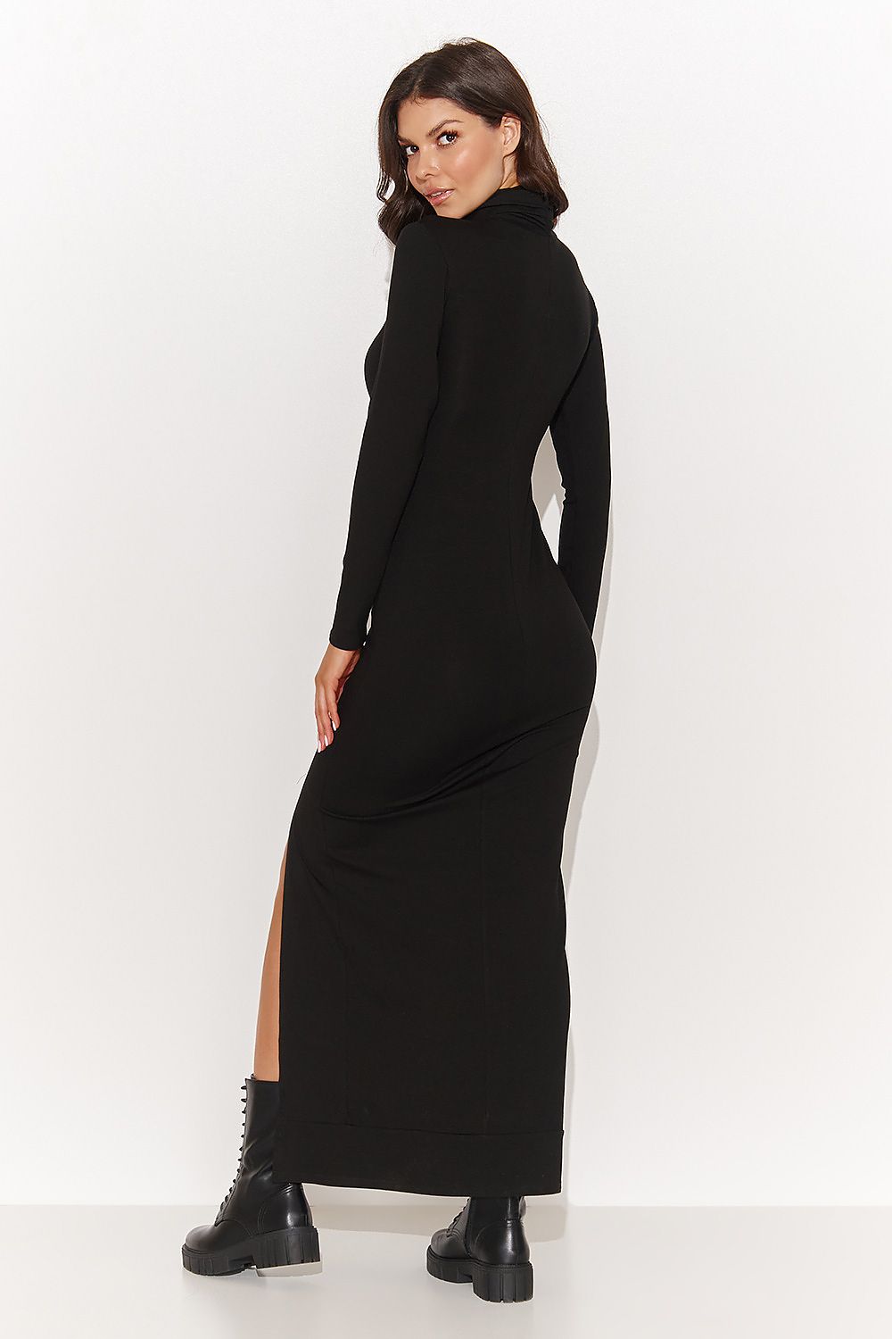 Chic detail of a black maxi dress by Numinou showing the flattering stretch viscose knit fabric and sophisticated turtleneck, perfect for elegant occasions.