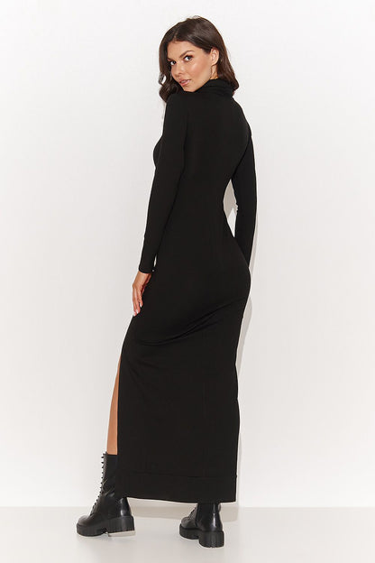 Chic detail of a black maxi dress by Numinou showing the flattering stretch viscose knit fabric and sophisticated turtleneck, perfect for elegant occasions.