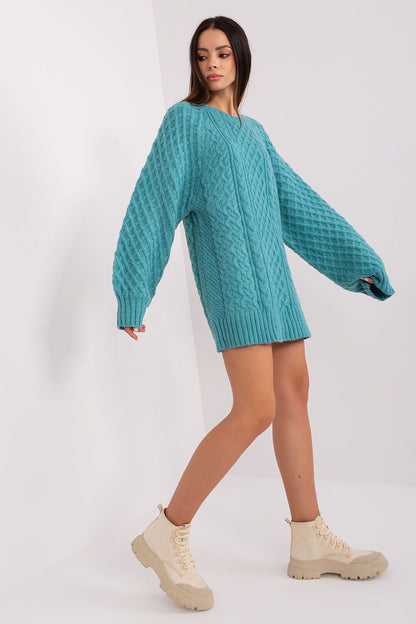 Stylish long-sleeve oversized sweater dress by AT, showcasing a unique variegated texture ideal for a chic winter ensemble.