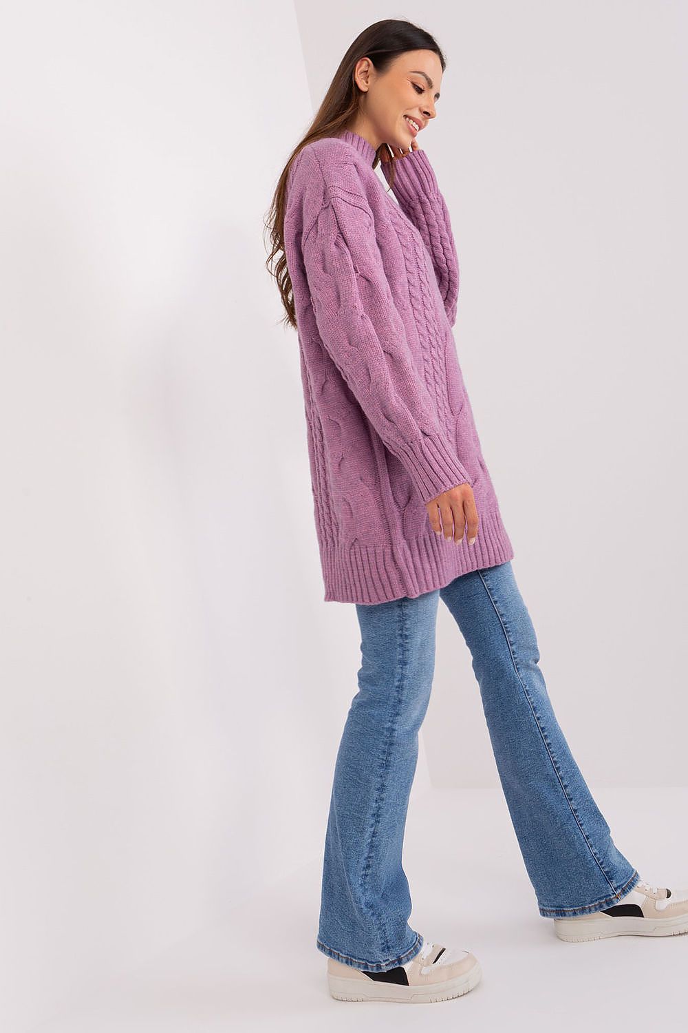 Luxurious oversized long turtleneck jumper in variegated acrylic blend by AT, showcasing its unique fabric texture and comfortable fit.