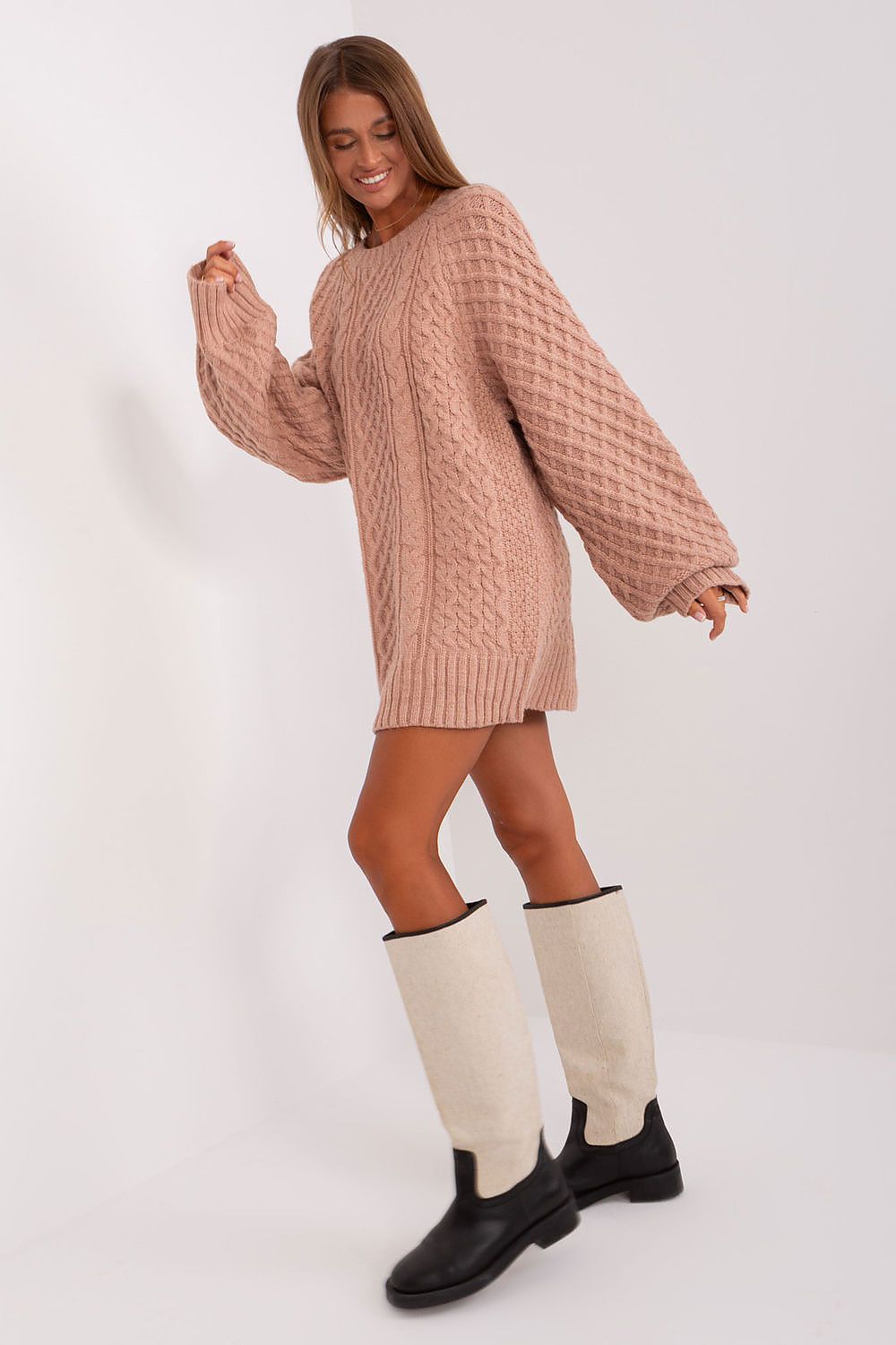 Stylish AT oversized sweater dress in a variegated pattern, designed for warmth and sophistication during chilly weather.