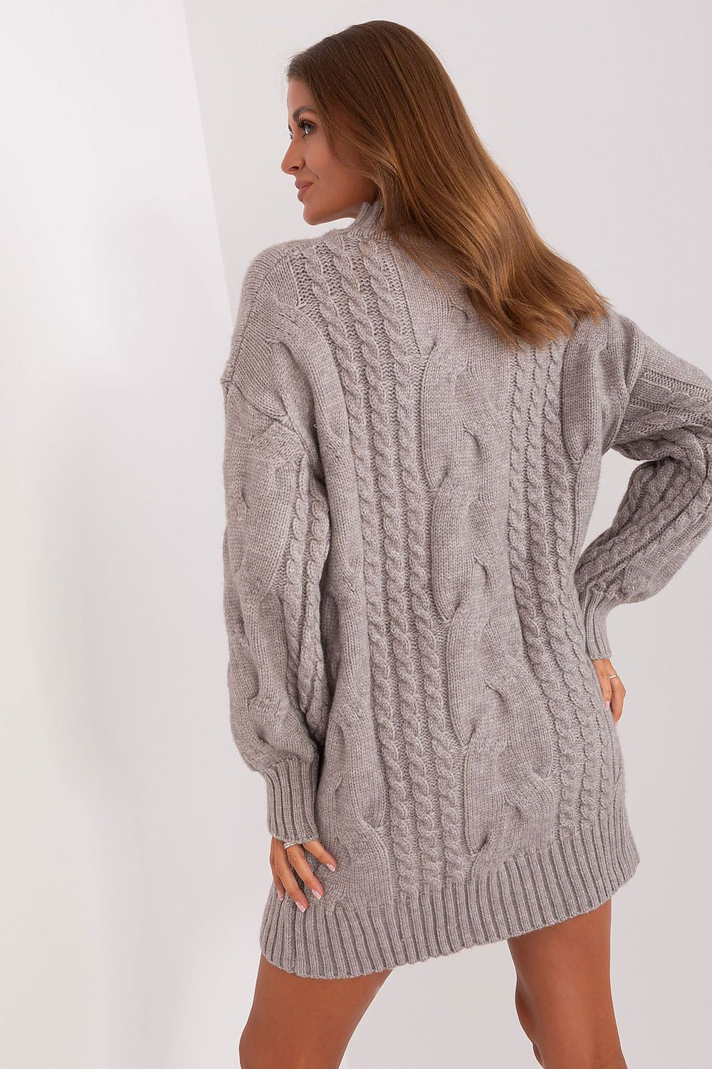 Soft and warm oversized jumper by AT, featuring a stylish turtleneck and before-the-knee length, perfect for colder days.