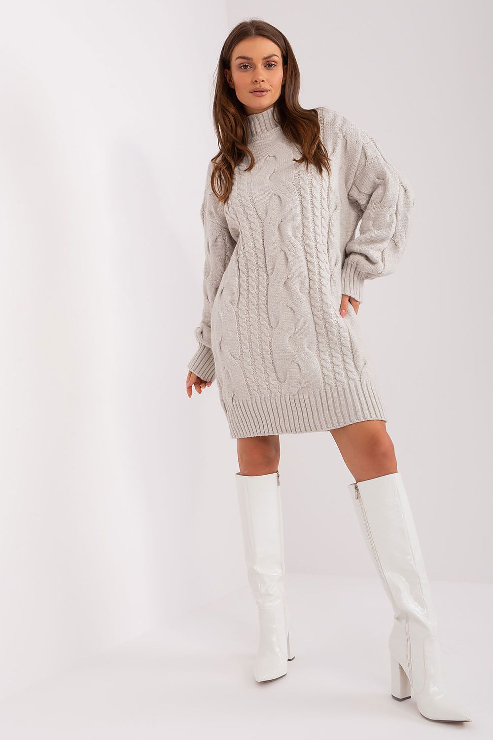 Model wearing a luxurious oversized long turtleneck jumper from AT styled as a short dress, ideal for chilly days.