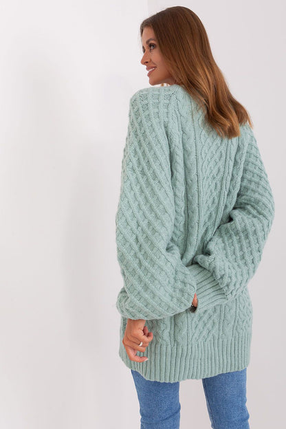 Sumptuous oversized long sweater in variegated acrylic fabric by AT, ideal as a short dress, exuding comfort and refined style.