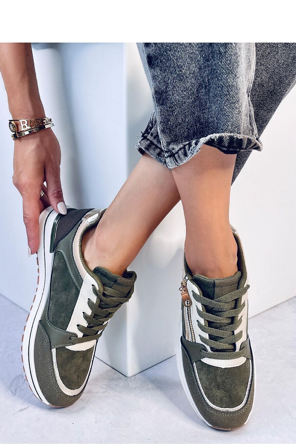 Luxury women's sport sneakers by Inello featuring lace-up design and metallic accents for a sophisticated casual look.