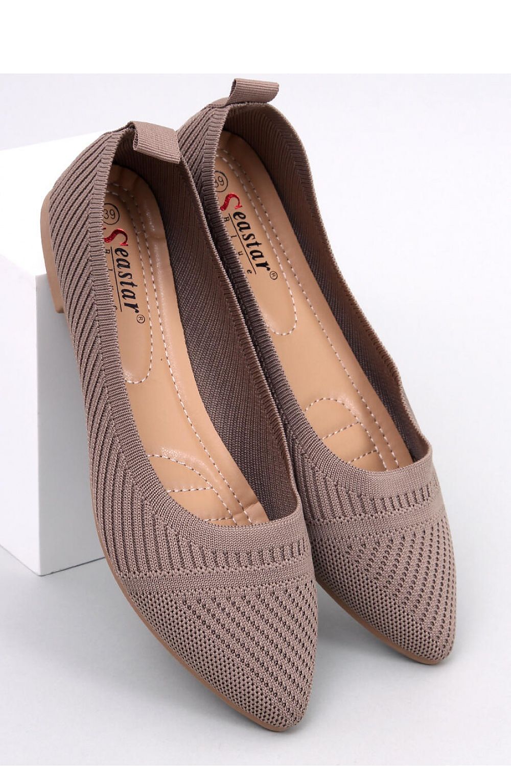 Elegant Inello women's woven ballet flats showcasing a chic almond-shaped nose design, perfect for sophisticated styling.