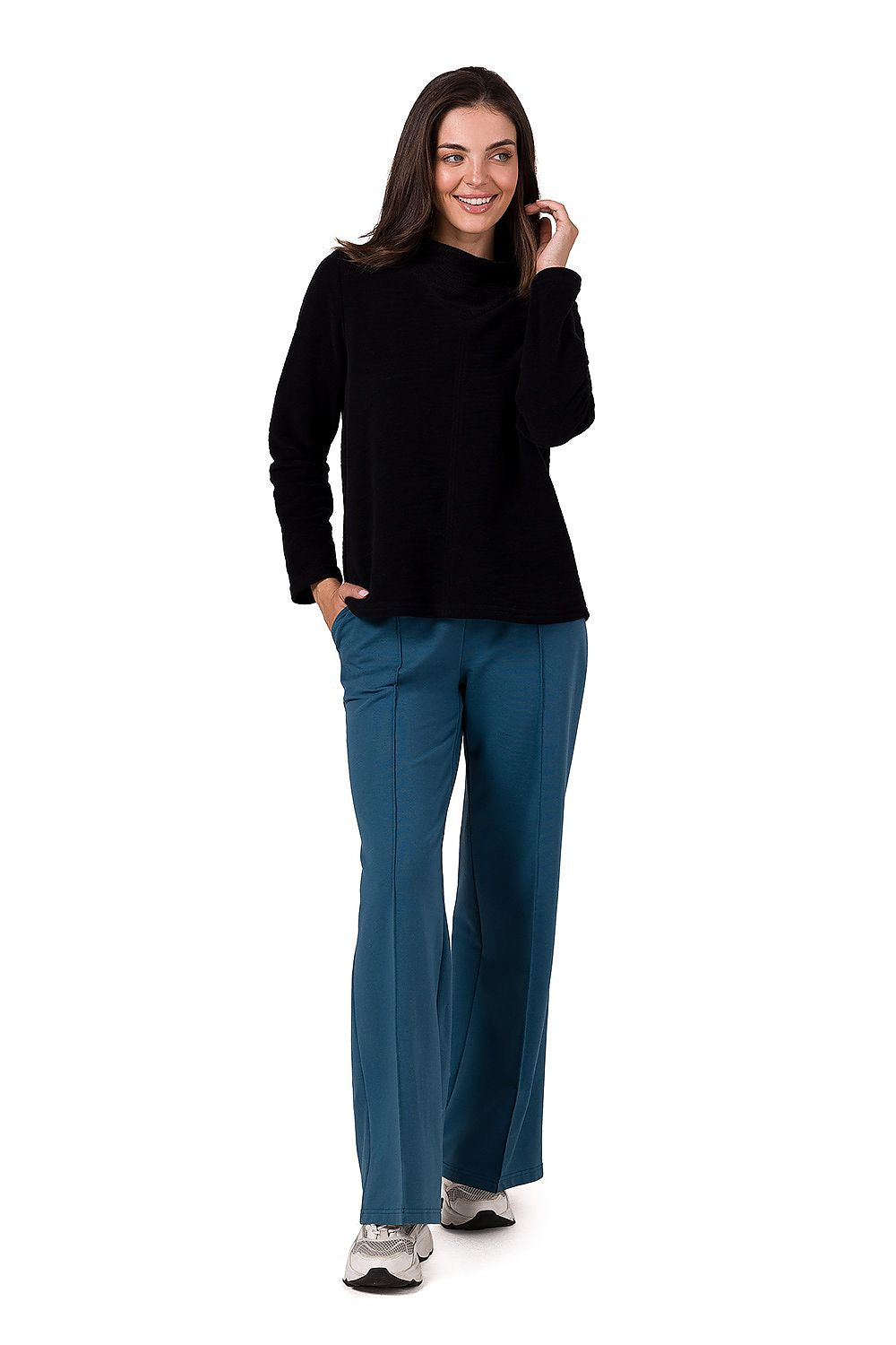 Model wearing a BeWear turtleneck sweatshirt, exemplifying timeless style and comfort for women’s fashion, suitable for any season.