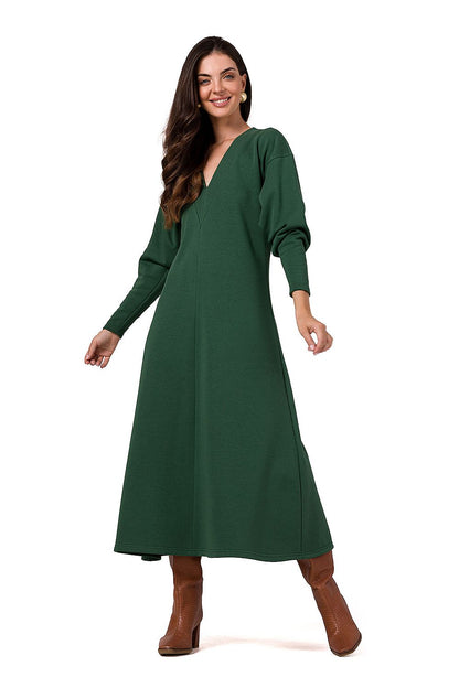 Elegant BeWear maxi knitted dress featuring long sleeves and deep V neckline, showcasing luxurious comfort and style.