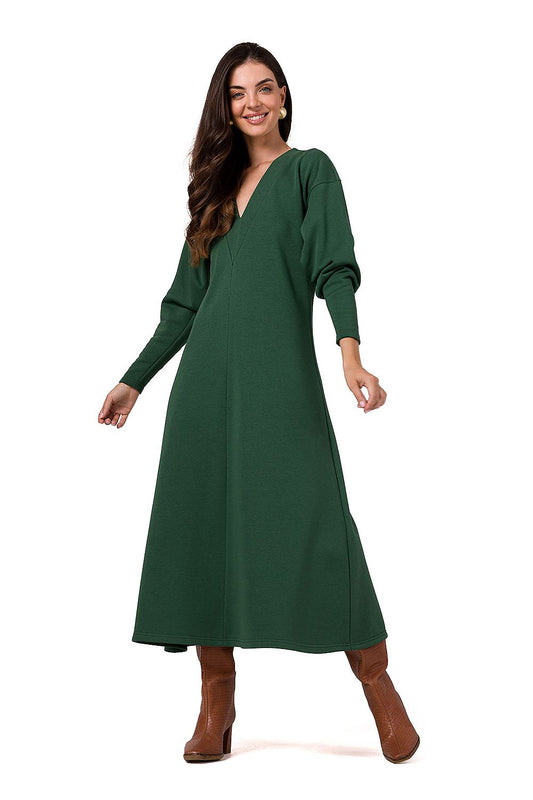 Elegant BeWear maxi knitted dress featuring long sleeves and deep V neckline, showcasing luxurious comfort and style.