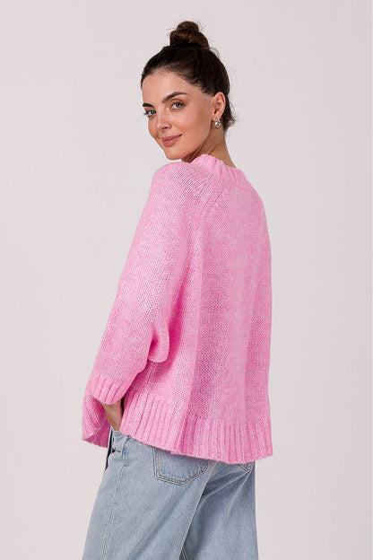 Stylish women's oversized knit jumper in luxurious ribbed yarn featuring batwing sleeves, offering a fashionable look for winter, crafted in Poland.