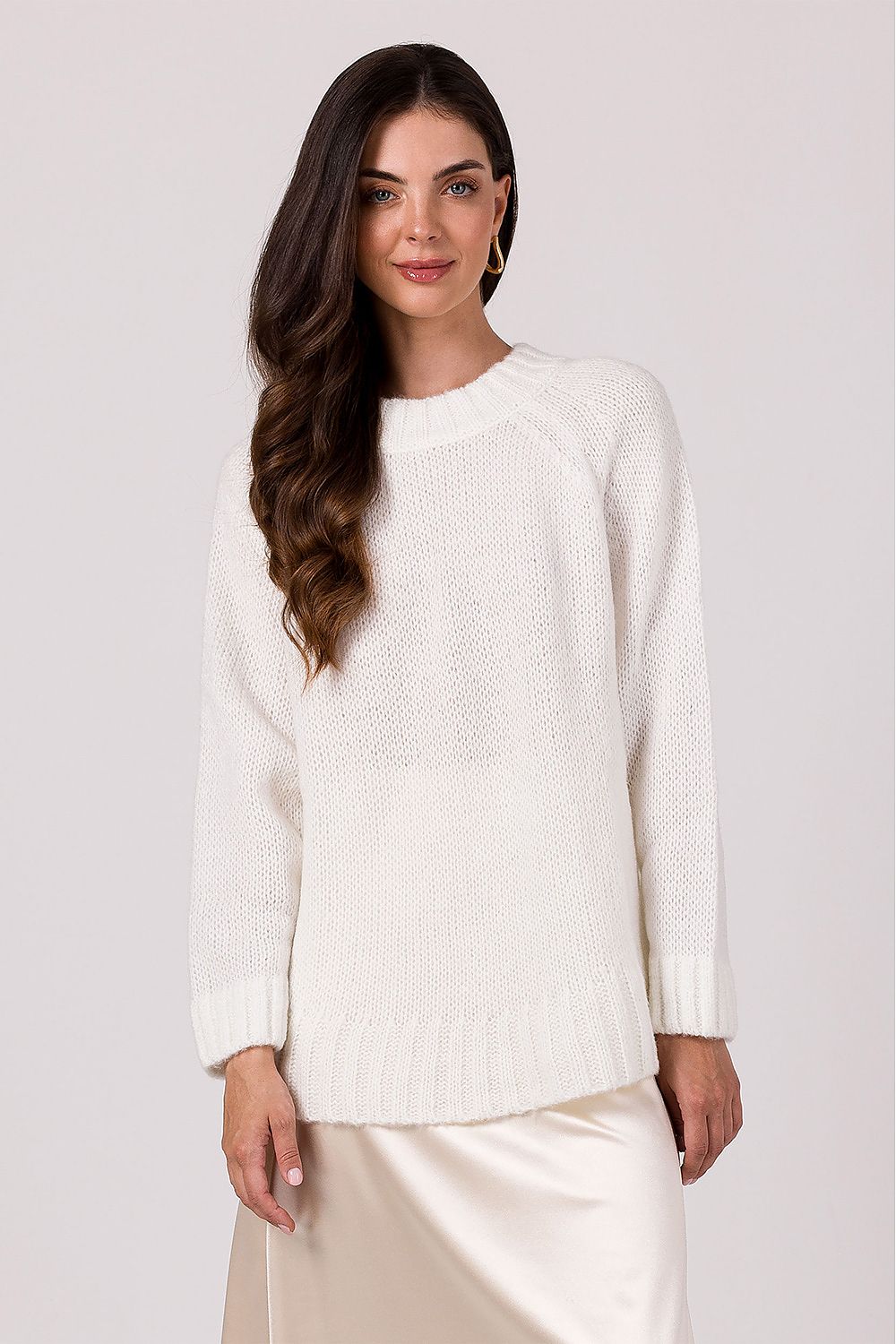 Chic women's oversized jumper styled casually, demonstrating its versatility to pair beautifully with jeans or skirts.