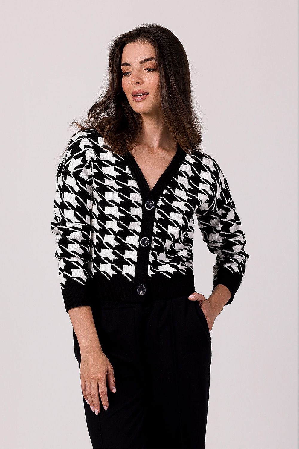 Elegant BE Knit Cardigan worn casually with jeans, demonstrating versatility and comfort for everyday wear, crafted from soft acrylic.