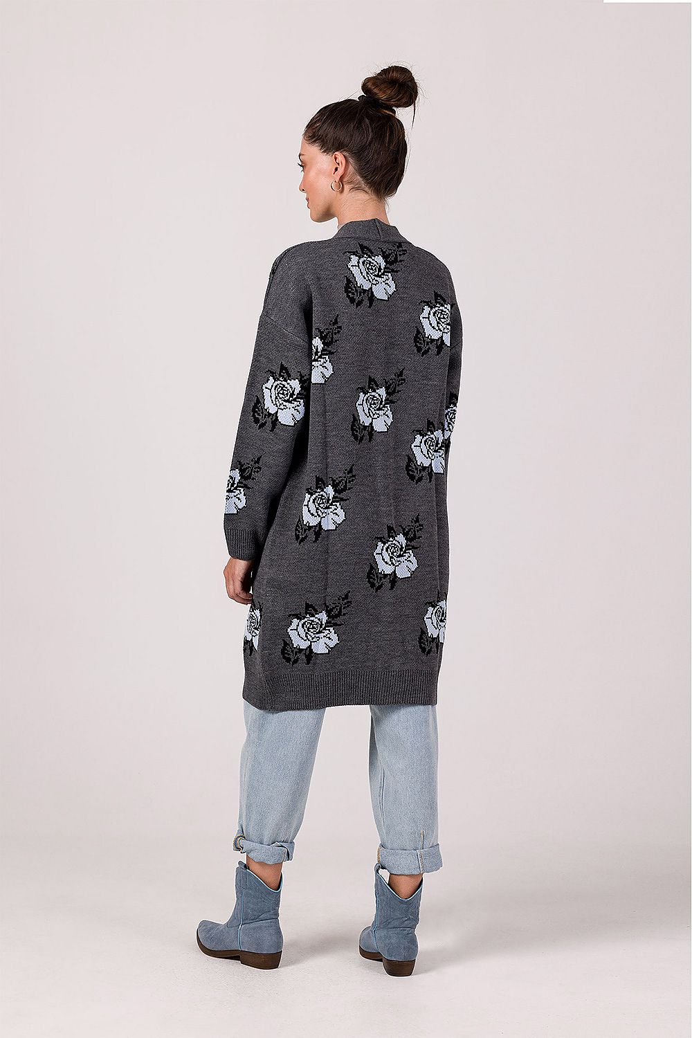 Detail of the lowered shoulder line and long sleeves of the exclusive BE Knit beige floral cardigan.