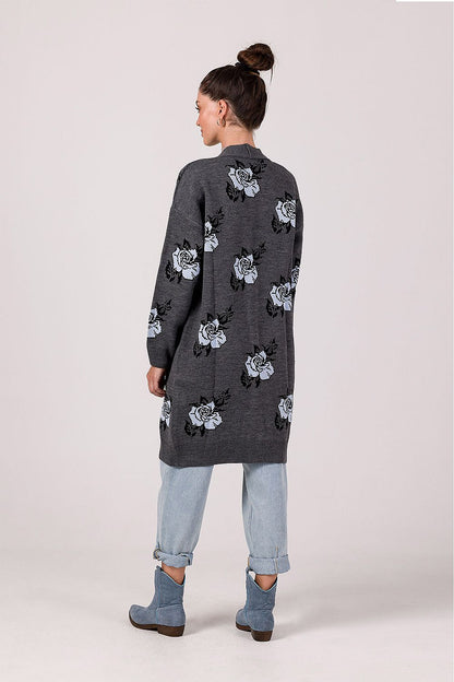 Detail of the lowered shoulder line and long sleeves of the exclusive BE Knit beige floral cardigan.