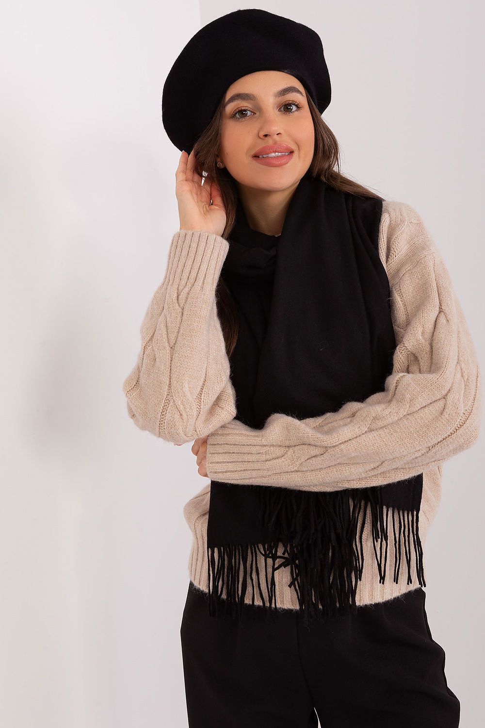 Fashionable model wearing a chic plain beret with antenna, illustrating its versatility and the luxurious feel of high-quality fabrics.