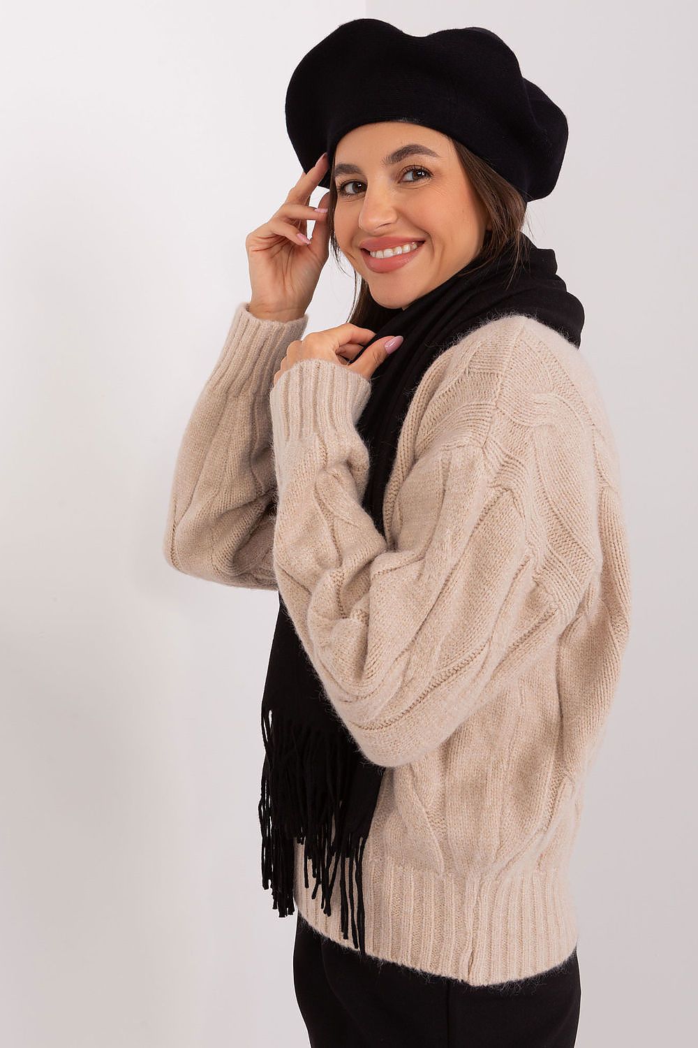 Artistic flat lay of a plain beret with delicate antenna, highlighting its elegant style and premium materials, perfect for enhancing any fashionable outfit.