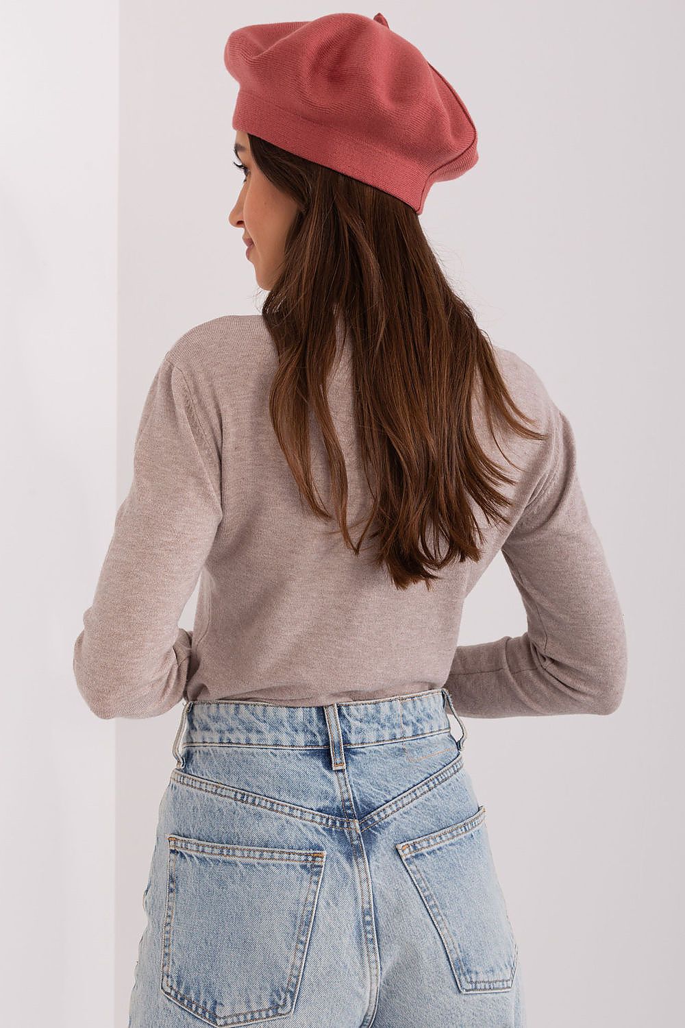 Elegant shot of the chic beret on a backdrop, perfectly illustrating its versatile style for sophisticated looks.