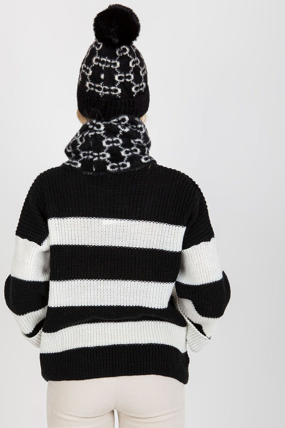 High-quality winter cap crafted from 100% acrylic, showcasing a fashionable pom-pom and a snug fit for superior warmth.