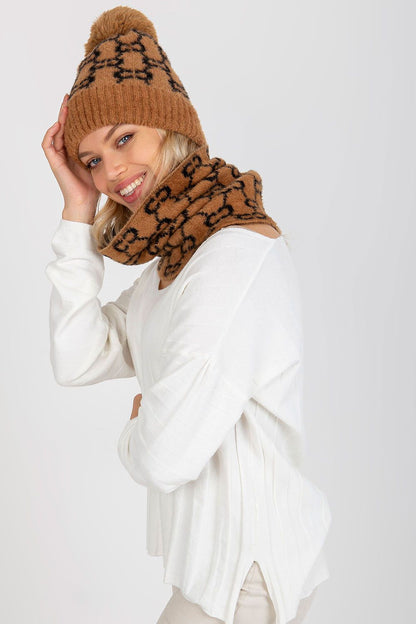 Chic and cozy winter cap, luxurious 100% acrylic material with a stylish wide welt and pom-pom for a trendy look.