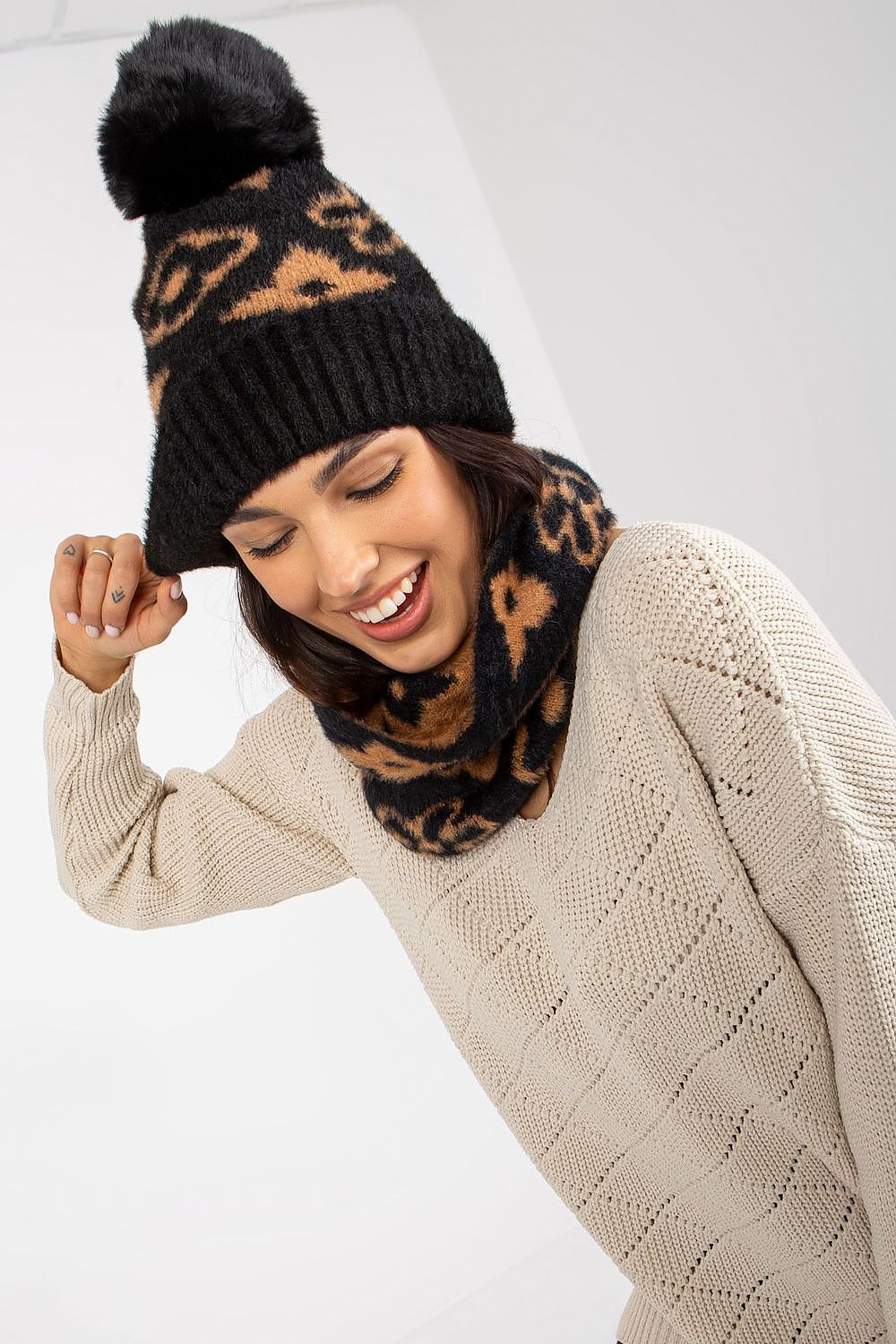 Luxury thick acrylic winter cap with stylish pom-pom, offering warmth and elegance for winter fashion.