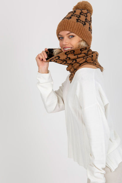 Stylish matching cap paired with a unique patterned infinity scarf, perfect for a chic winter ensemble.