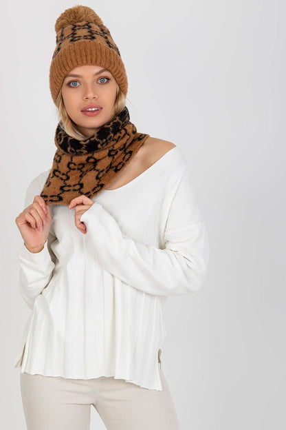 Fashion-forward model wearing the luxurious infinity scarf and matching cap, showcasing a trendy winter look.