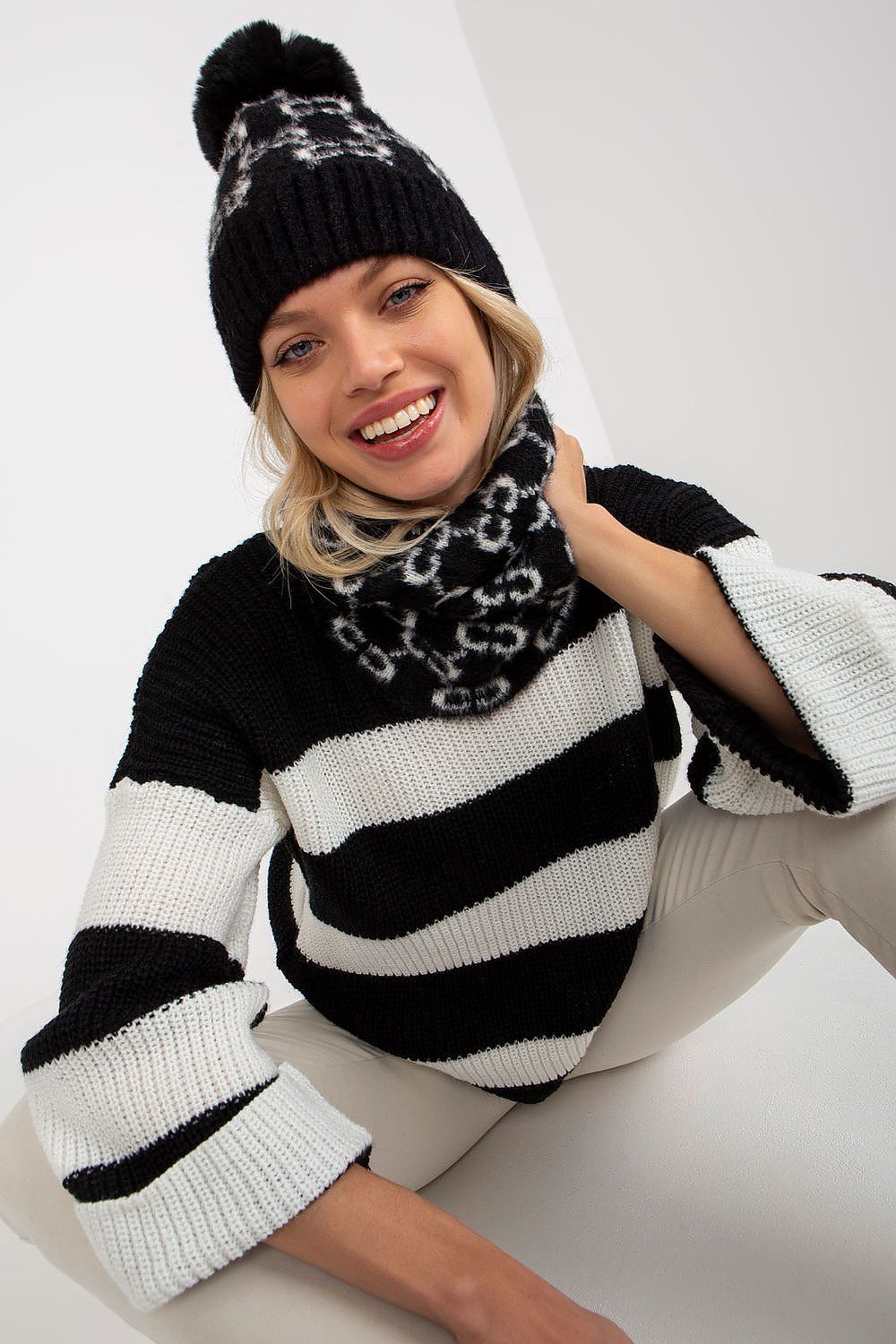 Close-up detail of the intricate pattern on a premium acrylic infinity scarf, showcasing its luxurious texture and vibrant colours.