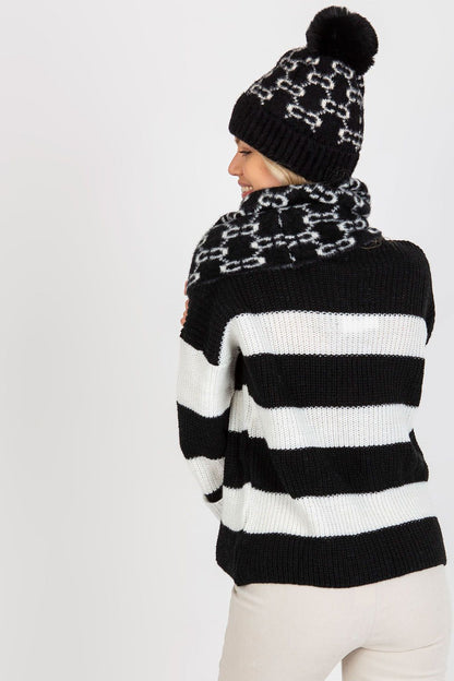 Elegant infinity scarf made from 100% acrylic, designed to be paired with a matching cap for a sophisticated winter look.