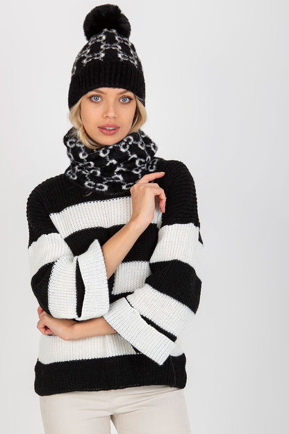 Model wearing a lavish infinity scarf with a distinctive pattern, highlighting its versatility and warmth for cold weather outings.