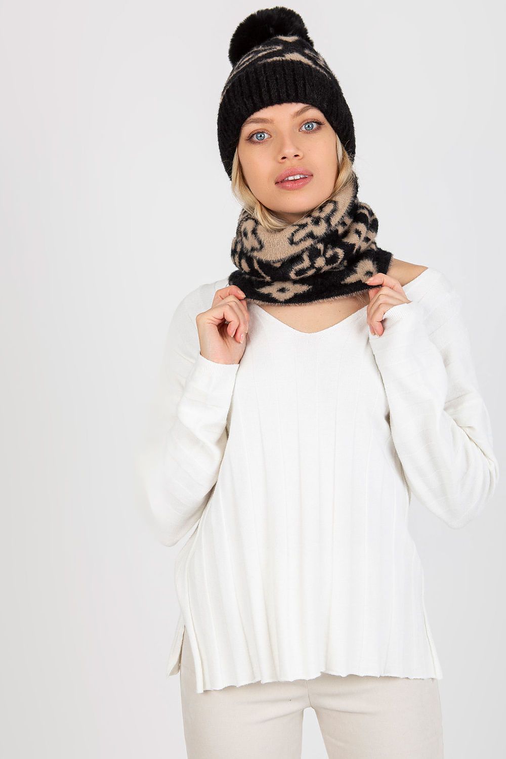 Chic acrylic infinity scarf draped elegantly, highlighting its unique pattern for fashionable winter wear.