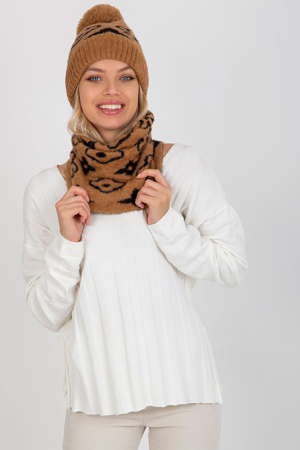 Chic infinity scarf in a beautifully designed pattern, crafted from high-quality acrylic for ultimate warmth and sophistication.
