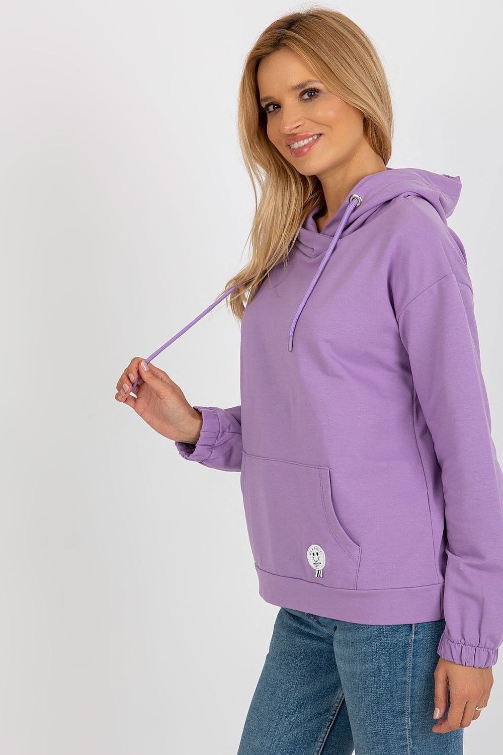 Close-up of the elegant patch detail on a cozy cotton hoodie, blending fashion and functionality seamlessly.
