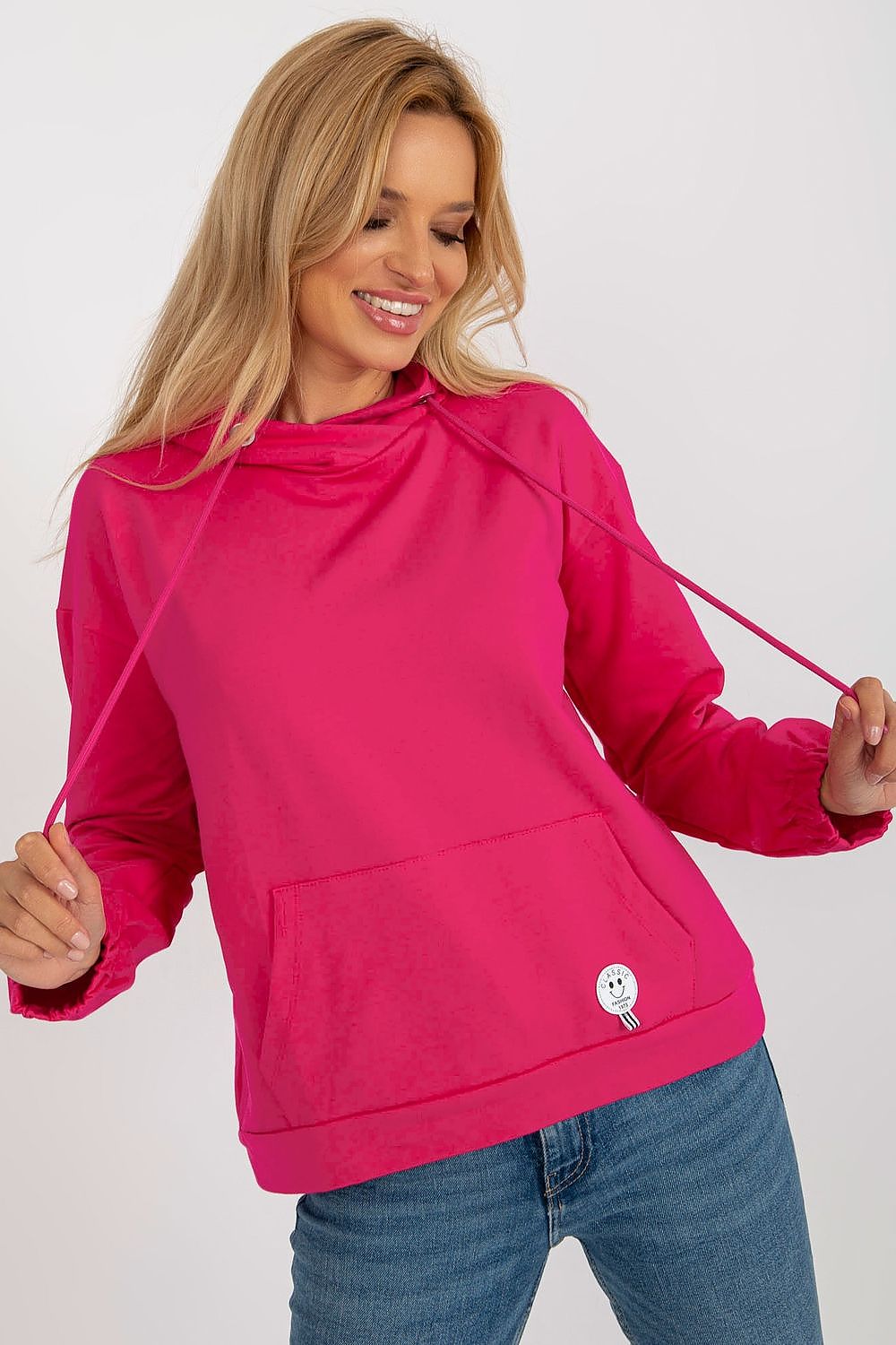 Dramatic angle of a plush hoodie sweatshirt with kangaroo pocket, emphasising its unique style and high-quality fabric.