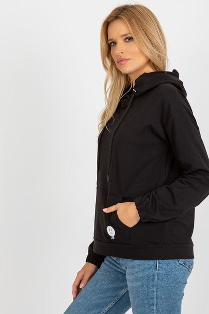 Elegant long sleeve cotton hoodie with tie hood, showcasing a unique patch on the kangaroo pocket, ideal for a chic and relaxed look.