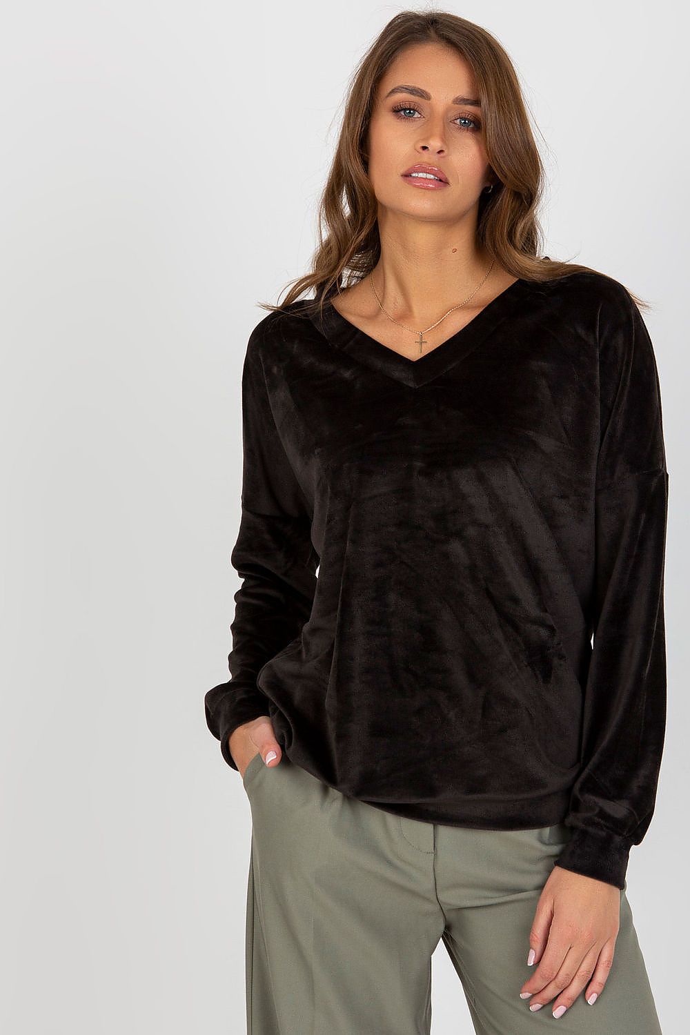 Stylish flat lay of luxury velour sweatshirt highlighting its elegant design and comfortable features for fashionable cold weather attire.