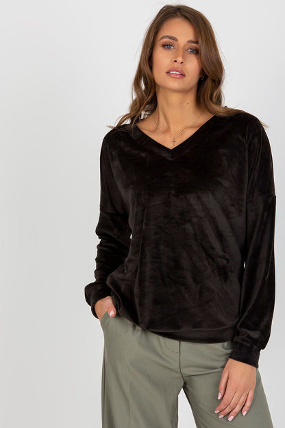 Stylish flat lay of luxury velour sweatshirt highlighting its elegant design and comfortable features for fashionable cold weather attire.