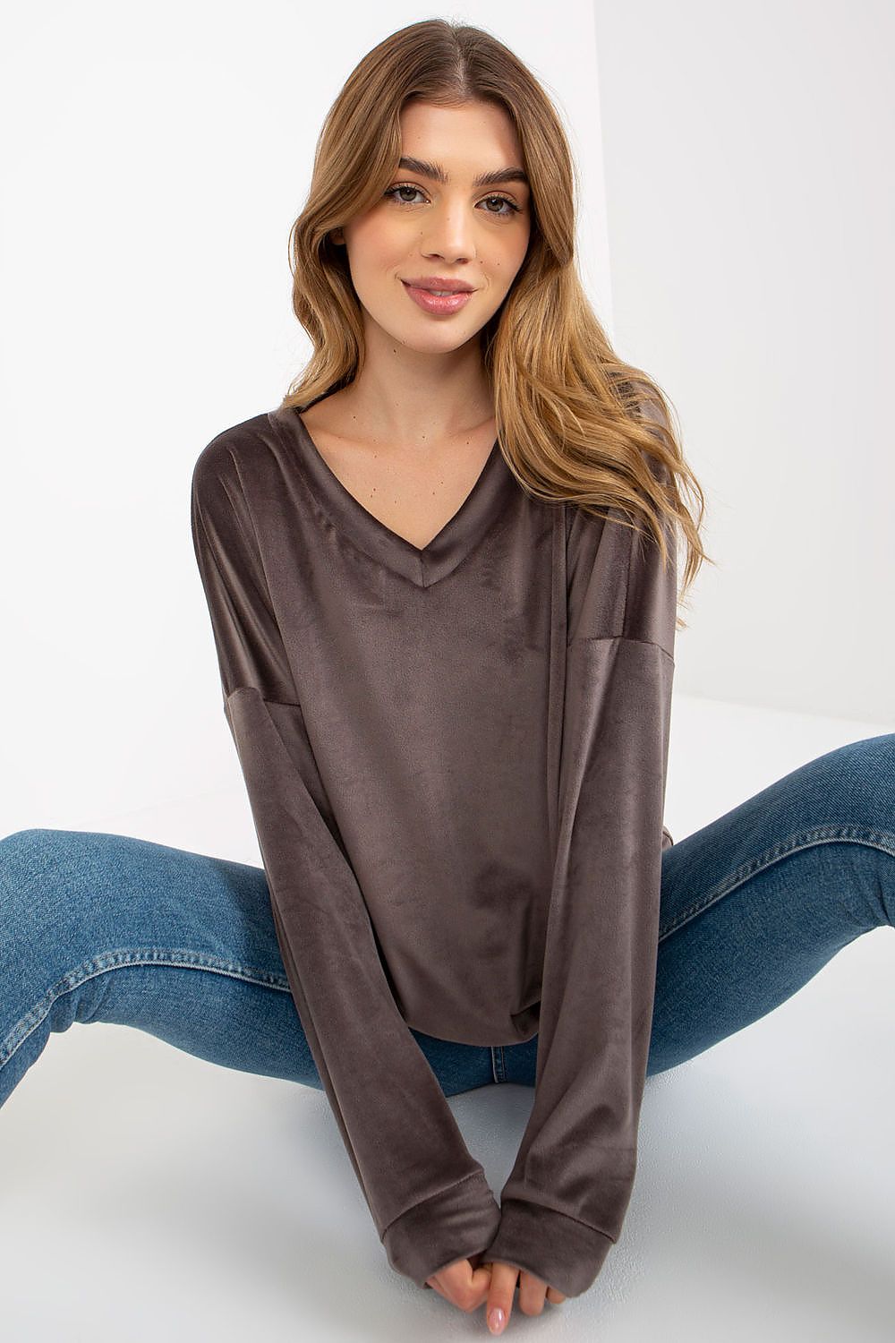 Stylish velour sweatshirt showcased in a versatile design, ideal for layering and enhancing any outfit.