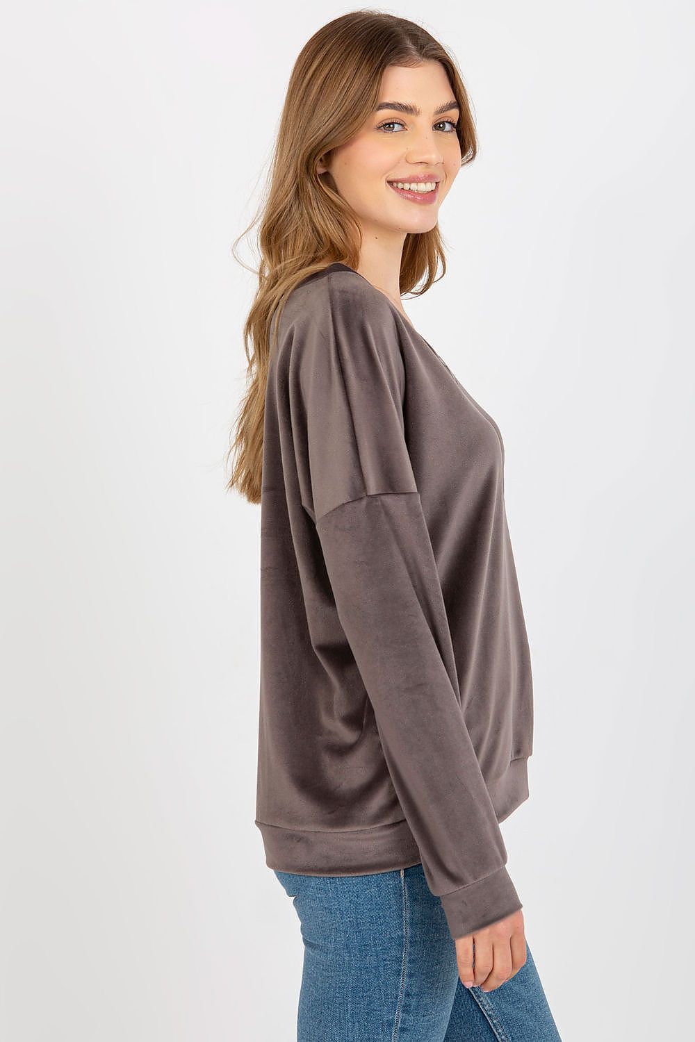 High-quality velour fabric sweatshirt with a chic V-neck, designed for a blend of comfort and fashion for chilly seasons.
