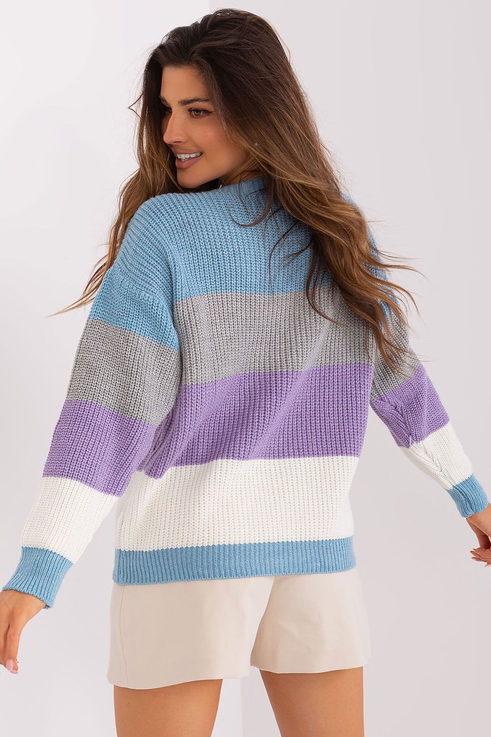 Badu's Casual Striped Jumper laid flat, highlighting its sophisticated stripe pattern and boat cut neckline, an ideal staple for a chic lifestyle.
