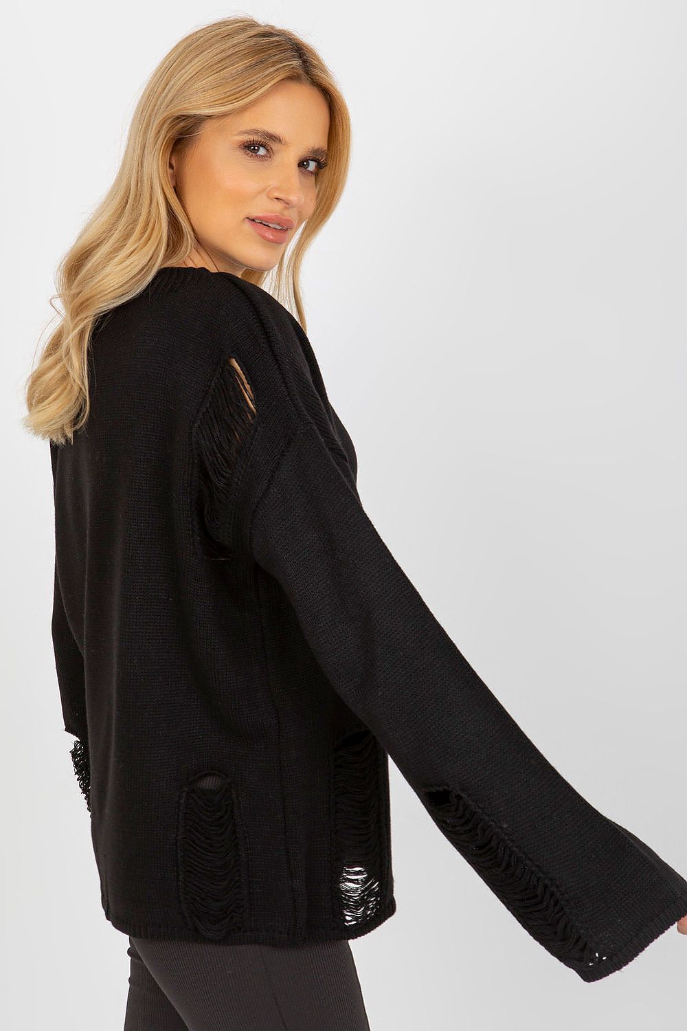 Badu's chic casual sweater displayed on a hanger, emphasising the unique design elements including the boat neckline and subtle decorative holes.