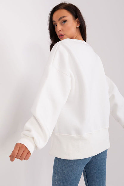 Close-up view of the chic asymmetrical design and soft cotton fabric of Ex Moda's women's sweatshirt, showcasing its modern appeal and comfortable fit.